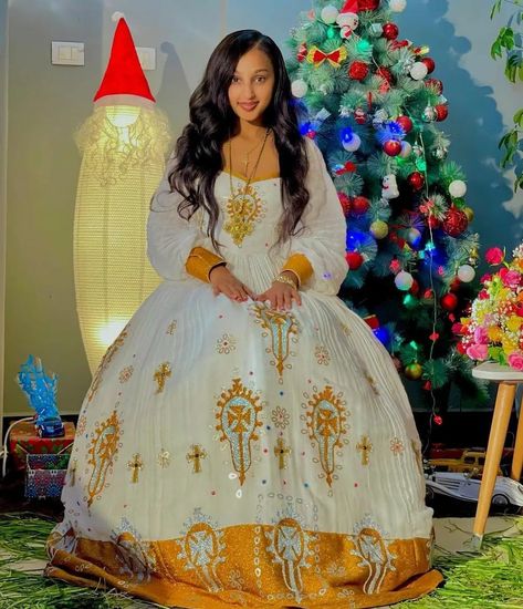 Discover the allure of Ethiopian fashion at your fingertips! 🧡 EthiopianClothing.net invites you to experience a blend of tradition and trend. Browse now and redefine your fashion story.አዳዲስ ልብስ ለማግኘት ቴልገራም ቻናላችንን  ይቀላቀሉ፡፡ 👉 https://t.me/menendress ይደውሉልን/መልእክት ይላኩልን +251938057705/ +251913040753 Whatsapp/IMO/Telegram #ethiopiaclothing  #habeshakemis  #kmise #africanwomen #culturaldress #habeshadress Traditional Dress Design, Ethiopian New Year, Eritrean Women, Ethiopian Wedding Dress, Eritrean Dress, Beautiful Ethiopian, Ethiopian Wedding, Ethiopian Clothing, Habesha Dress