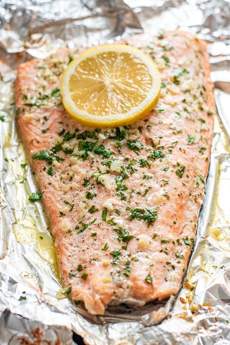 Garlic butter steelhead trout in foil is the easiest way to prepare trout. Season the fish with garlic, lemon, butter, salt, and pepper, and bake in foil for 20 minutes. Easy cleanup and super delicious #troutrecipes #steelheadtrout How To Cook Trout, Steelhead Trout Recipe Baked, Steelhead Trout Recipe, Trout Fillet Recipes, Trout Recipe, Grilled Trout, Haddock Recipes, Fish Entrees, Mediterranean Recipes Healthy