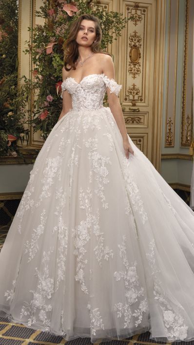 Once upon a time, there was a royal and romantic dress for the modern princess bride. The Liv design features an off-the-shoulder neckline and ball gown silhouette. The beautiful cathedral skirt is removable and transforms into a floor-length gown - a seamless transition from ceremony to reception! Additions to the dress include matching sleeves (included) and matching train (available separately from Koonings). Wedding Dresses Off The Shoulder, Dresses Off The Shoulder, The Princess Bride, Modern Princess, Sweetheart Wedding Dress, Wedding Dress Accessories, Princess Bride, Brides Wedding Dress, Floor Length Gown