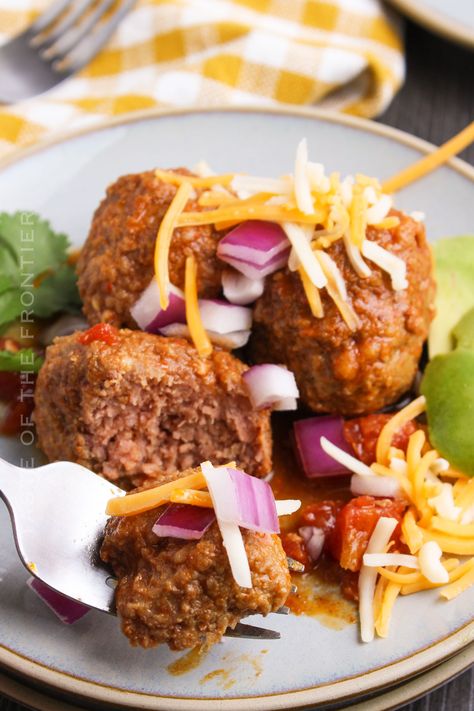 Mexican Meatballs made with seasoned ground beef, spices, and zesty salsa, these mouthwatering meatballs bring the fiesta to your plate. Taco Meatballs Ground Beef, Mexican Meatball Casserole, Mexican Meatballs With Rice, Mexican Style Meatball Soup, Pioneer Woman Tex Mex Meatballs, Beef Spices, Meatballs Crockpot, Mexican Meatballs, Breakfast Donuts