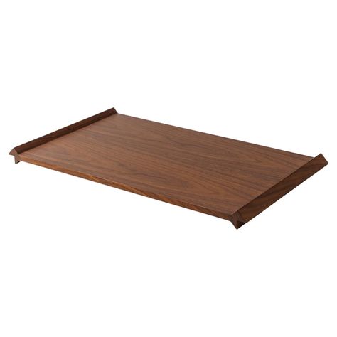 Designed by Rui Alves, this tray showcases a simple rectangular shape featuring a useful rim on the edges - a plane surface and two elements that support and elevate it. The simplicity of this principle and its usual representation of geometric design are at the origin of this piece. The consistency of the shapes results in unique, visual and tactile details, capturing attention without obfuscating the objects it supports. Available in 3 variants of natural wood, slight variations in colour can Design Objet, Tray Design, Wood Joinery, Wood Tray, A Plane, Joinery, Walnut Wood, Serveware, Geometric Design