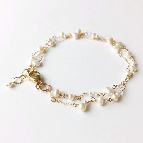 "Poppy Linen Bracelet" is perfect for our pearl lovers out there. Dainty and simple yet makes a beautiful statement. Pair it with a classic Caroline bangle for an elevated look.  - Two strands of dainty white pearls in various shapes and sizes are accented by small chain. Small, faceted crystal quartz add a hint of shi White Pearl Chain Jewelry For Everyday Elegance, White Jewelry For Everyday Elegance, Elegant Bracelet With Pearl Drop, Elegant Everyday Bracelets With Pearl Drop, Elegant Everyday Bracelet With Pearl Drop, Elegant Pearl Chain Beaded Bracelets For Everyday, Elegant Everyday Bracelet With Pearl Charm, Delicate Adjustable Pearl Bracelet, Delicate White Double Strand Jewelry