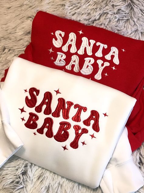 Cute Santa Baby Christmas Crewneck Sweatshirt!!   Made to order with top quality embroidery thread! Sweatshirt Colors: WHITE, RED  Sweatshirt Sizes: S, M, L, XL, 2XL, 3XL Sweatshirts are Gildan 18000 (G180) Heavy Blend.  8oz., 50/50 pre-shrunk cotton/polyester. Processing time 5-7 days. Please contact me with any questions!! No returns or exchanges on made to order items but if there is an issue, please contact me and I will take care of it promptly!! Christmas Sweatshirt Ideas, Christmas Party Sweater, Cute Santa Claus, Christmas Dreaming, Preppy Christmas, Party Sweaters, Cute Santa, Cute Shirt Designs, Christmas Feeling