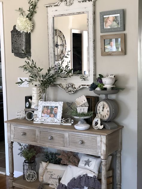 Hobby lobby console table with rustic mirror, olive stems, chippy goodness, vintage scale and pretty greens and florals for spring time. Chalk Painted Candlesticks, Hobby Lobby Farmhouse Decor Living Room, Wire Wall Decor, Sofa Table Decor, Living Room Console Table, Hobby Lobby Decor, Painted Candlesticks, Entry Table Decor, Old House Interior