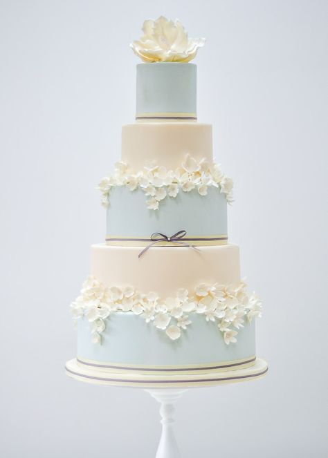 36 Seriously Gorgeous Spring Wedding Cakes You'll Love! Spring Wedding Cakes, Blue And Ivory Wedding, Daffodil Wedding, 5 Tier Wedding Cakes, Sugar Flower Wedding Cake, Blush Wedding Cakes, Ivory Wedding Cake, Painted Wedding Cake, Sugar Flowers Cake