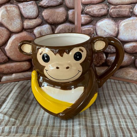 Vintage 3d Ceramic (4") Brown Smiling Monkey Holding A Banana Coffee/Tea Mug With Tail New , In Good Condition , No Cracks , Repairs , Has Crazing , Has Stain In Front (In Pic) , Small Chip On Hands(In Pic). Brown/Yellow Size-- 4" Ceramic Smiling Monkey Holding A Banana Tail This Very Cute Smiling Monkey Coffee/Tea Mug Will Brighten Up Your Mornings Smoke Free & Pet Free Thanks For Stopping By...................... Have A Cup Of Coffee In Your New Mug And Look Around.................. ,,,,,,,,,,,,,,,,,,,,,Save This Closet & Get Notifications When I Upload New Listings,,,,,,,,,,,,,,,,,,,,,,,,,,,,,,,,,,,,,,,, Monkey Mug, Monkey Coffee, 3d Ceramic, Banana Coffee, A Banana, Pottery Painting, Cup Of Coffee, Tea Mugs, Shop House