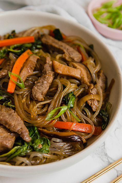 This traditional Korean Noodle Stir Fry, Japchae is made with sweet potato noodles and is naturally grain-free! It's paleo, soy-free, gluten-free, and AIP compliant. Sweet Potato Glass Noodles Recipe, Glass Noodle Stir Fry, Glass Noodles Recipe, Gluten Free Dairy Free Dinner, Korean Glass Noodles, Soy Sauce Alternative, Unbound Wellness, Noodle Stir Fry, Autoimmune Paleo Recipes