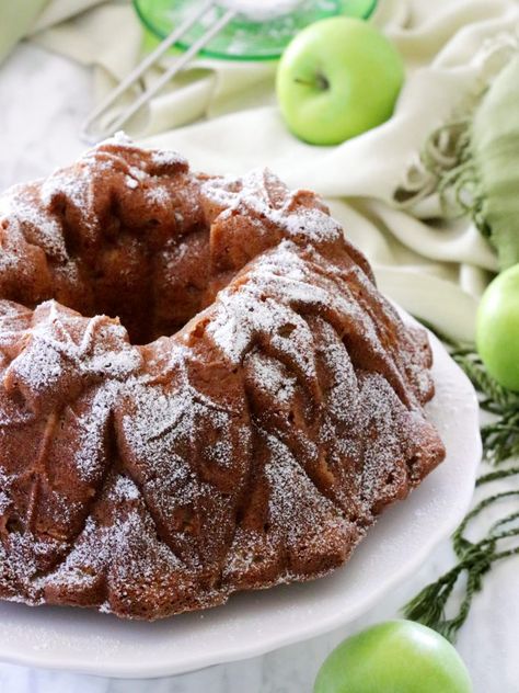 A moist and delicious Olive Oil Apple Cake chock full of granny smith apples. It's topped with powdered sugar and served with a caramel sauce. #applecake #oliveoilcake #italiancake #apple #caramel #dessert Butter Ball Cookies Recipe, Apple Almond Cake, Butterball Cookies, Cake Apple, Easy Apple Cake, French Apple Cake, Apple Bundt Cake, Fresh Apple Cake, Vegan French