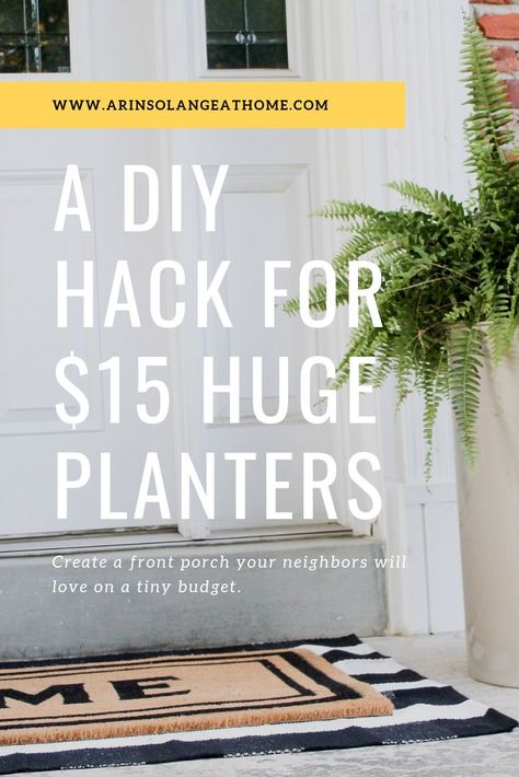 Create an easy, modern front porch for $100.  Use this fun planter hack to include huge planters, and layer these rugs for a chic, easy porch you will love! https://www.arinsolangeathome.com #frontporch #diyplanters #planter #frontporchdecor Planter Between Garage Doors, Diy Front Porch Planters Cheap, Tall Porch Planter Ideas, Diy Entry Planters, Planter Front Of House, Garage Door Planter Ideas, Front Porch Large Planter Ideas, Front Patio Planter Ideas, Front Porch Ideas Pots & Planters