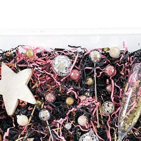 Ashley • Family Activities, Kids Sensory, and Homeschool on Instagram: "new years sensory play ⭐️💕🥂  threw a bunch of new years themed colors/things in a bin for the kids to play with: paper shred, disco balls, disco ball stir sticks, filler balls, champagne flutes, confetti, and an @oak.and.co star!  swipe to see last years version of this bin as well as another fun sensory bin idea: disco ball sorting! ✨  #sensoryplay #sensorybin #sensorybins #sensory #sensoryactivity #activitiesforkids #kidsactivities #activitiesfortoddlers #activitiesforchildren #activitiesforpreschoolers #childrensactivities #montessori #montessoriactivity #boymom #girlmom #momlife #momstagram #momfluencer #mominfluencer #momsofinstagram #momsupportingmoms #newyear #newyears #happynewyear" New Years Eve Sensory Bin, New Years Sensory Bin, New Year Sensory Bin, Sensory Table, Kids Sensory, Sensory Bin, Stir Sticks, Disco Balls, Montessori Activities