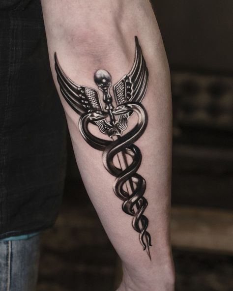 The caduceus, featuring two snakes wrapped around a staff, is an ancient and powerful symbol used in mythology and medicine. Getting a caduceus tattoo... Doctor Symbol Tattoo, Staff Of Caduceus Tattoo, Hermes Caduceus Tattoo, Staff Of Hermes Tattoo, Medical Snake Tattoo, Medical Staff Tattoo, Hermes Staff Tattoo, Cadeusus Tattoo Design, Caduceus Tattoo Men