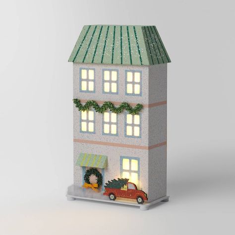 Create a magical holiday scene with this Lit LED Paper House Christmas Village Building from Wondershop™. Made of paper, this white paper house with a green roof is decorated with beautiful ornaments for a festive touch. Its flat base and LED lighting make it great for placing on your mantel or console table, either alone or paired with other holiday decor. Welcome to the Wondershop™. Paper House Ornaments, Paper Christmas Village, Shelf Placement, Village Tree, Christmas Village Collections, Christmas Crafts Diy Projects, Farmhouse Candles, Lantern Christmas, Artificial Christmas Wreaths