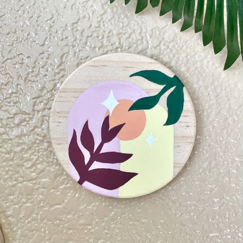 A hand painted wooden circle 3”x3” with two dome doorways, orange moon, and lilac sky with stars and botanical accents Circular Canvas Painting, Jungle Painting, Sky With Stars, Circular Canvas, Diy Drawing, Lilac Sky, Orange Moon, Wooden Circle, Botanical Leaves