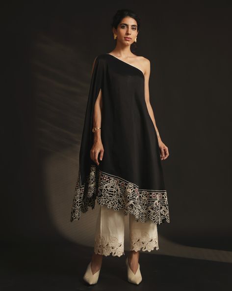 BLACK OFF SHOULDER ASYMMETRIC KURTA | C H A N D R I M A Kurta Black, Asymmetric Kurta, Swept Back Hair, Kurta Women, Cutwork Embroidery, Trendy Dress Outfits, Black Off Shoulder, Embroidered Neckline, Indo Western