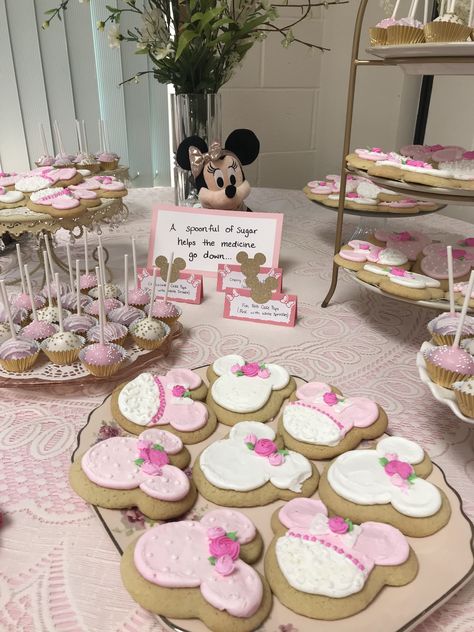 Disney pink and gold dessert table for baby shower - “A spoonful of sugar helps the medicine go down” (Mary Poppins), Minnie Mouse cookies and cake pops Minnie Mouse Baby Shower Dessert Table, Minnie Mouse Dessert Table Ideas, Pink And Gold Dessert Table, Gold Dessert Table, Mouse Cookies, Minnie Mouse Cookies, A Spoonful Of Sugar, Gold Dessert, Baby Shower Dessert Table