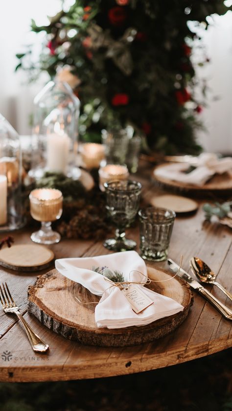 Classic rustic holiday wedding place setting with wood centerpieces and cloth napkins | rustic wedding decorations, DIY rustic wedding, country rustic wedding, rustic wedding ideas, rustic wedding colors, rustic wedding reception, rustic wedding centerpieces, rustic wedding on a budget, fall rustic wedding, elegant rustic wedding, rustic wedding ceremony, rustic wedding table decor, simple rustic wedding, rustic wedding theme, rustic wedding party, napkin fold with silverware, napkin fold ideas Pine Tree Centerpiece Table Decorations, Pine Branch Table Decor, Wood Slab Wedding Centerpiece, Round Table Wedding Decor Rustic Wood Slices, Simple Wedding Centerpieces Wood Slice, Nature Themed Wedding, Rustic Wedding Colors, Rustic Wedding Table Decor, Rustic Wedding Ceremony