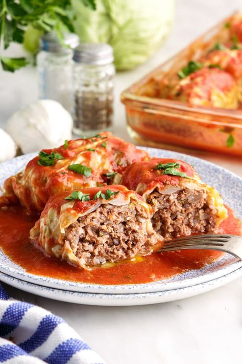 Ground beef, Italian sausage, long grain rice, and plenty of flavorful seasonings are stuffed inside tender cabbage leaves then doused in tomato sauce in this cabbage roll recipe. Slow Cooker Cabbage Rolls, Stuffed Cabbage Rolls, Cabbage Roll, Cabbage Rolls Recipe, Stuffed Cabbage, Mince Recipes, Hot Italian Sausage, Homemade Tomato Sauce, Cabbage Leaves