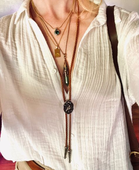 Layered necklaces with crystal & bolo tie gold jewelry Women’s Bolo Tie, Women’s Bolo Tie Fashion, How To Style Bolo Tie, Bolo Tie Necklace Outfit, How To Style A Bolo Tie Women, Styling Bolo Tie Women, Women Bolo Tie, Bolo Outfits Women, Women Bolo Tie Outfit