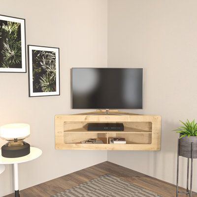 Introducing the corner TV stand - a sleek and stylish addition to your home entertainment setup. Crafted from durable 8mm MDF, this stand is built to last and features three spacious open shelves for your media devices, accessories, and decorative items. The screwless and timeless design of this wall-mounted stand gives your living space a modern, futuristic vibe. Plus, its space-saving design is perfect for small apartments or rooms where floor space is limited. Assembly is a breeze with the in Tv Wall Decor Living Room Small Space, Corner Tv Stand Ideas Living Rooms Small Spaces, Tv Unit Decor Corner, Small Tv Space, Wall Mounted Tv Stand Ideas, Mounted Tv Corner, Bedroom Tv Wall Ideas Small Spaces, Small Tv Stand Ideas, Corner Mounted Tv Living Room