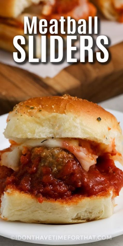 Meatball sliders will put extra fun into any game day gathering. This quick and easy recipe is a cinch made from frozen meatballs, simmered in a rich marinara sauce. Slide them onto Hawaiian rolls brushed with garlic butter, top with shredded mozzarella, and enjoy! This hot and hearty snack will keep family and guests satisfied for hours. #meatballsliders #meatballslidersrecipe #idonthavetimeforthat #hawaiianrollmeatballsliders Pull Apart Meatball Sliders, Garlic Bread Meatball Subs, Pull Apart Sandwiches, Easy Meatball Sliders, Garlic Bread Meatball, Easy Crowd Meals, Meatball Sliders Recipes, Breaded Meatballs, Meatball Sandwiches