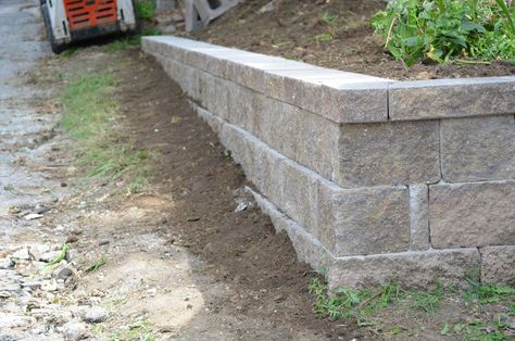 short retaining wall ideas | We’ve created a page dedicated to retaining wall ideas and photos ... Retaining Wall Lighting, Small Retaining Wall, Retaining Wall Ideas, Retaining Wall Design, Building A Retaining Wall, Landscaping A Slope, Concrete Retaining Walls, Sloped Backyard, Stone Retaining Wall