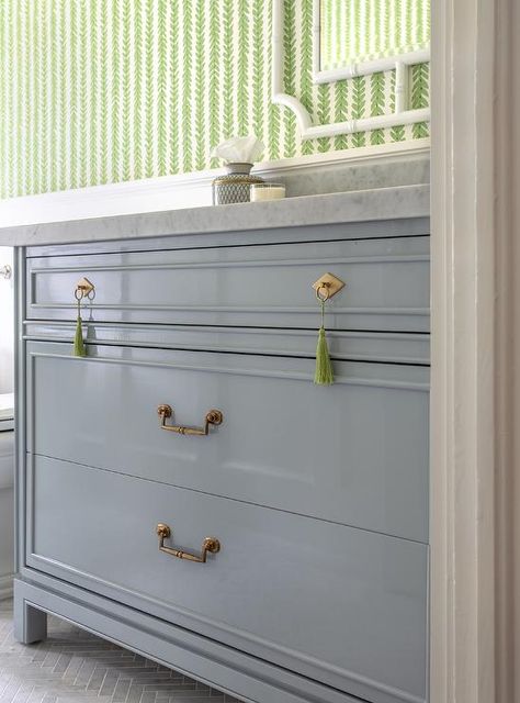 Antique brass pulls and green tassel pulls complement a light blue washstand topped with a gray marble countertop finished with a matching backsplash. Sophisticated Cottage, Katie Davis Design, Blue Bath Vanity, Antique Brass Pulls, Katie Davis, Houston Heights, White Bathroom Designs, White Shiplap Wall, Blue Vanity