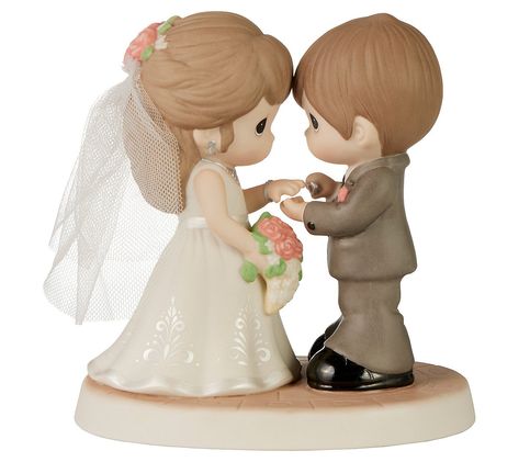 Celebrate the beauty of love and commitment with the Precious Moments With This Ring Figurine, capturing the magical moment of saying "I do." This meticulously sculpted piece features a bride in her tulle veil with a cascading bouquet and a groom with a sheepish smile, symbolizing the joy and depth of their special day. From Precious Moments. Precious Moments Cake Topper, Precious Moments Wedding Cake Toppers, Sheepish Smile, My Precious Moments, Sunshine Wedding, Precious Moments Wedding, Wedding Toppers, Cascading Bouquet, Tulle Veil