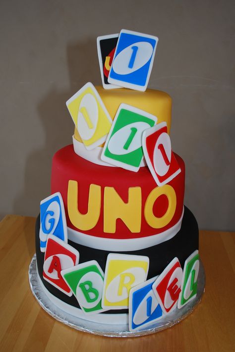 UNO Themed Cake for First Birthday - The first birthday theme was UNO.  It is a 3 tiered chocolate cake / chocolate mousse filling / chocolate frosting.  The cake is covered with fondant and the UNO cards are made of fondant. Uno Party, Uno Birthday, Bolo Sonic, Uno Card, Smash Cakes, Uno Cards, 1st Birthday Themes, First Birthday Themes, Crazy Cakes