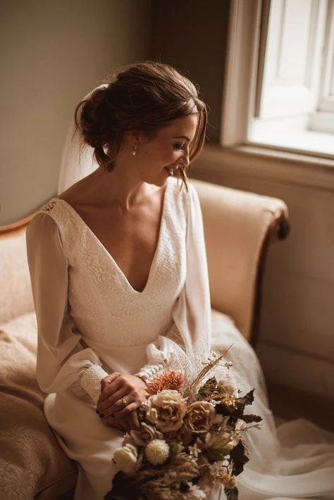 Bride in a modern simple wedding dress featuring clean lines and a minimalist aesthetic | BRIDES Modern Simple Wedding Dress, Elegant And Timeless Wedding, Timeless Wedding Gown, Vintage Inspired Wedding Dresses, Timeless Wedding Dress, Simple Wedding Dress, Most Beautiful Wedding Dresses, Bridal Elegance, Stunning Gowns