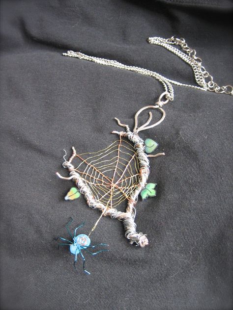 This is a spiderweb pendant I made from twisted wire of different finishes and gauges finished off with handmade spider and leaves. Beaded Spiders, Wire Jewelry Designs, Wire Wrapping Stones, Diy Wire Jewelry, Wire Work Jewelry, Twisted Wire, Handmade Wire Jewelry, Wire Weaving, Wire Crafts