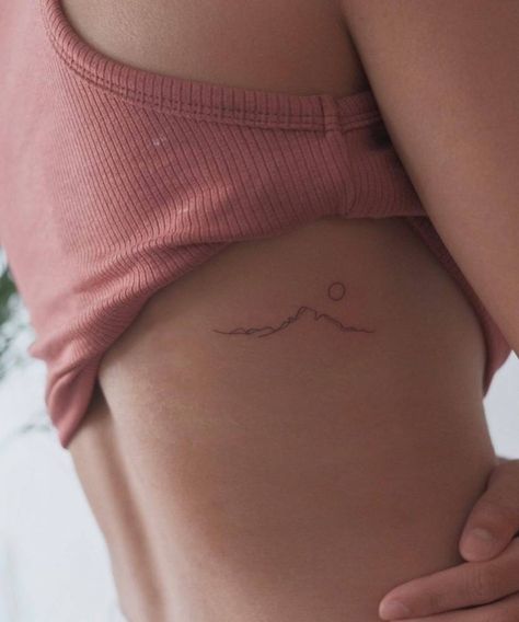 Minimalist mountain tattoo on the rib. Minimalist Mountain Tattoo, Tattoo Idea For Women, Small Mountain Tattoo, Berg Tattoo, 27 Tattoo, Small Rib Tattoos, Tattoos On Side Ribs, International Tattoo, Mountain Tattoo Simple