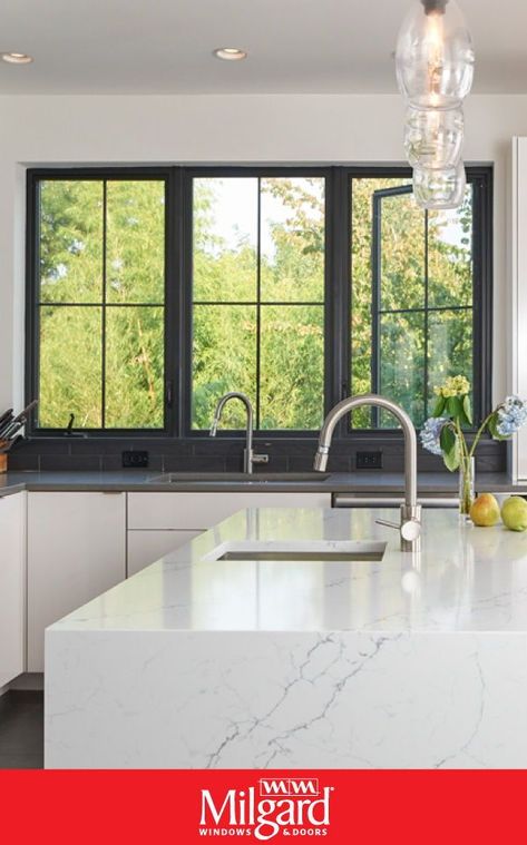 For a modern kitchen look try using black casement windows. The frames are bold and provide a beautiful contrast against the white walls, cabinets and kitchen island. Plus, the operating style allows both natural light and fresh air to come into the kitchen. Featuring UltraTM Series windows by Milgard Windows & Doors. #kitchenwindowideas #kitchenideas #homedecorideas #modernkitchenideas Colonial Grid Windows, Black Windows With Grids, Black Window Grids, Modern Window Design Exterior, Black Casement Windows, Modern Windows Exterior, Windows With Grids, Window Design Modern, Black Frame Windows