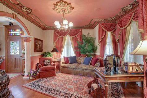 Queen Anne Victorian Comes With 1880s Decor and Income Opportunity | realtor.com® Royal Sitting Room, 1900s Living Room, Queen Anne Victorian House Interior, Victorian House Interior Design, Victorian Upholstery Fabric, Gold Velvet Sofa, Queen Anne Victorian House, Room Reading Nook, Queen Anne House