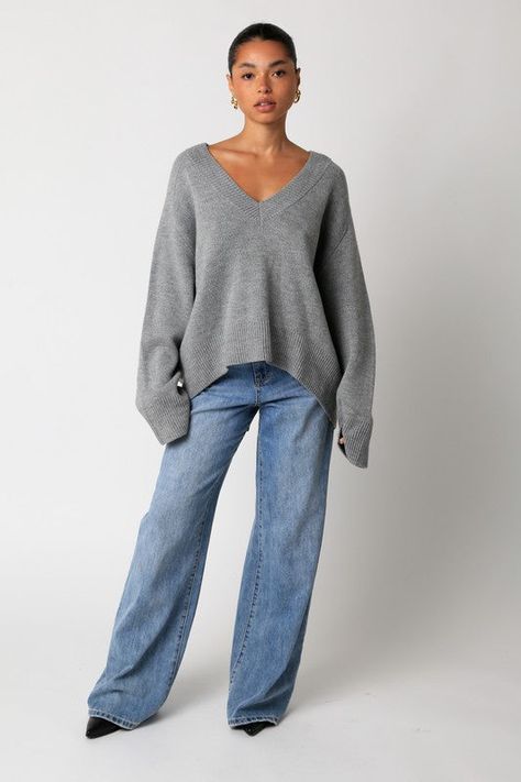 The Elsie sweater features a plunging v-neck in a trending, yet classic, heather grey. Fit is oversized with a cut hemline in the back. Fit chart in photos. V Neck Top Aesthetic, Sweaters For Woman, Oversized Cashmere Sweater Outfit, Fall Clothing Inspiration, V-neck Sweater, Grey Knit Outfit, Oversized Knit Top, V Sweater Outfit, Feminine Fall Fashion