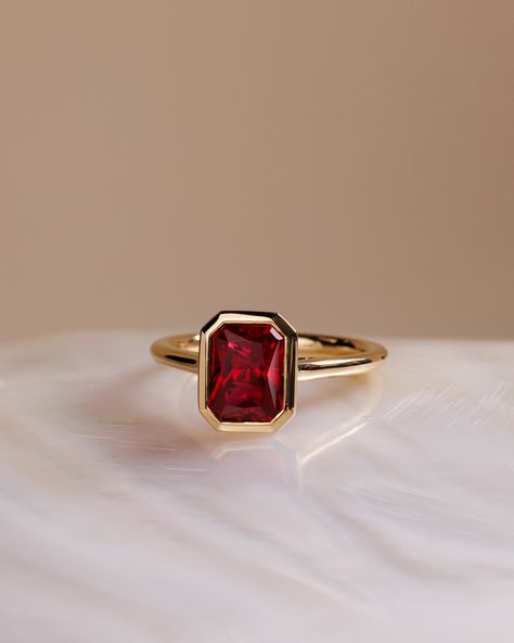 Add some colour to your ring stack❤️⁠ ⁠ The most stunning red sapphire (aka ruby) set into a bezel = obsessed. ⁠ ⁠ ⁠ Ring Details:⁠ Rachel – Bezel Set Radiant Solitaire⁠ 8.5x6.5mm ~ 2.20ct⁠ ⁠ Ruby Bezel Ring, Ruby Ring Stack, Colourful Engagement Rings, Sapphire Bezel Ring, Red Sapphire Ring, Rings 2023, Ruby Solitaire Ring, Wedding Rings Emerald Cut, Ruby Wedding Rings