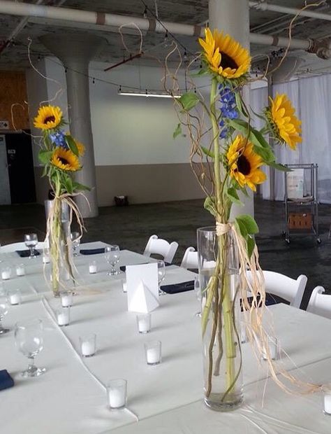 Sunflower and blue delphinium arrangements for the center pieces. Made by countryside florist Wedding Flowers With Sunflowers, Delphinium Centerpiece, Sunflower Centerpieces, Blue Delphinium, Pastors Appreciation, Corn Maze, Center Pieces, Delphinium, Flower Centerpieces