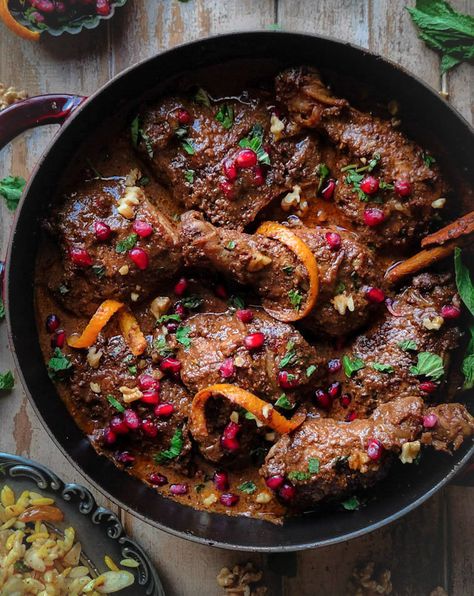 Chicken, Walnut and Pomegranate Stew, also known as Persian or Iranian Fessenjan in a pot, with mint leaves and jewelled rice on the side. Jewelled Rice, Stew With Chicken, Holistic Recipes, Rice Side, Scrumptious Food, Coconut Palm Sugar, Chicken Pieces, Autumn Recipes, Pomegranate Molasses