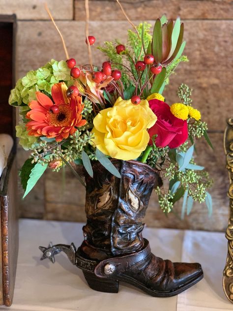 What a great way to honor / celebrate the Cowboy! Boot Flower Arrangement, Cowboy Boot Centerpieces, Boot Centerpiece, Rodeo Birthday Parties, Western Birthday Party, Western Birthday, Rodeo Birthday, Boot Jewelry, Western Theme