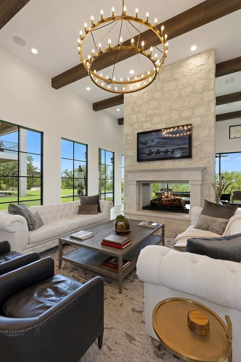 When the view continues seamlessly because of a double-sided #fireplace 😏

#garnerhomes #customhome #fireplacedesign Fireplace Split Living Room, Living Room Double Sided Fireplace, Double Sided Fireplace Vaulted Ceiling, Fireplace Dual Side, Large Double Sided Fireplace, Double Fireplace Ideas, Double Sided Fireplace Living Room Dining Room, Walk Around Fireplace Living Rooms, Fireplace In Middle Of Living Room And Dining Room