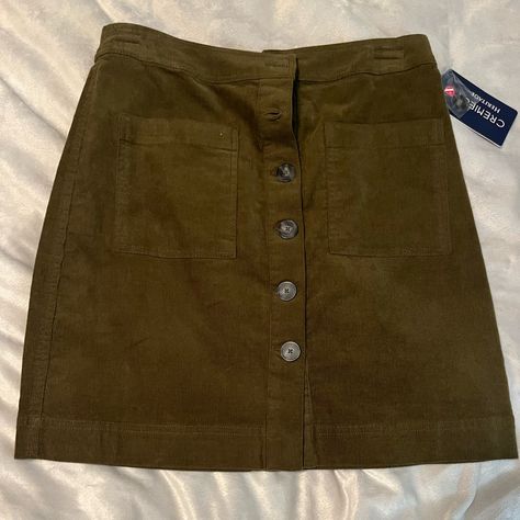 Never Been Worn, Looks Brown But Is Actually Dark Green Corduroy Skirt With Buttons And Front Usable Pockets, Comes With One Extra Button, Indents On Waistband Are From A Hanger Front: 17.75in Waist: 14.5in Back: 18 In Green Corduroy Skirt, Skirt With Buttons, Green Corduroy, Brown Skirts, Corduroy Skirt, Green And Brown, Dark Green, Size 4, Skirt