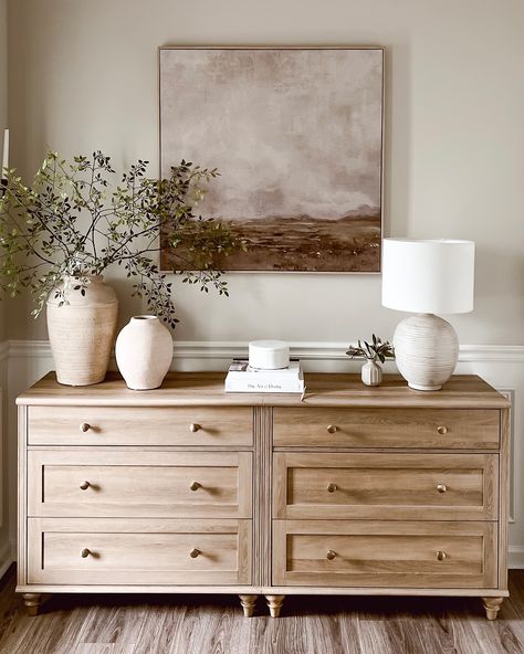 Before moving this dresser into our entryway hallway, I styled it in the front foyer. I loved the simplicity and serenity of the Neutral tones and natural textures create a calming entryway that invites warmth and peace from the moment you step inside. 🌟The first two pictures are what I styled before I decided to switch up the living room. The last three are what I ended up doing. 🤔What are your thoughts? Do you like the final result? Which one is your favorite? #HomeDecorInspo #Neutral... Gold And Wood Living Room, Entryway With Dresser, Living Room Dresser Decor, Entryway Dresser Ideas Front Entry, Neutral Modern Home, Entryway Room, Transitional Entry Way, Neutral Home Decor, Scandanavian Interiors Living Room