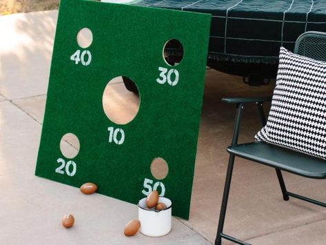 Make a Mini Football Toss Game to Add Some Fun to Any Tailgate | HGTV Corn Hole Trunk Or Treat, Football Trunk Or Treat Ideas, Football Trunk Or Treat, Football Toss Game, Tailgate Activities, Washer Toss Game, Outdoor Party Games, Corn Hole Diy, Tailgate Games