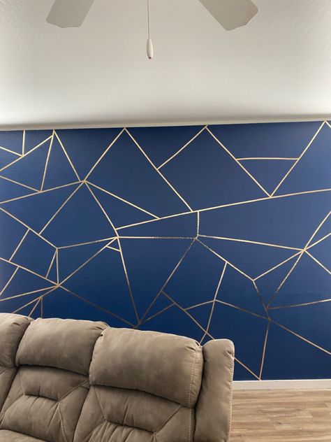 Blue and gold accent wall. Blue/Gold. Blue. Gold Trim. I didn’t think it was possible for me to do it but i did it!!!! Navy Wall With Gold Accents, Navy Blue Wall With Gold Stencil, Navy Blue Bedroom Walls Gold Accents, Accent Wall With Gold Trim, Gold Wall Accents, Blue Gold Room Decor, Accent Walls In Living Room Apartment, Navy Blue And Gold Accent Wall, Navy And Gold Accent Wall