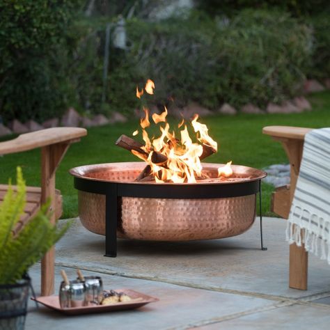 A gorgeous hammered copper fire pit so you can make marshmallow roasting seem like a Michelin-star kind of meal. Diy Fire Pit Ideas, Copper Fire Pit, Outside Fire Pits, Outdoor Fire Pit Designs, Fire Pit Ring, Fire Pit Furniture, Copper Wood, Fire Pit Bowl, Patio Fire Pit