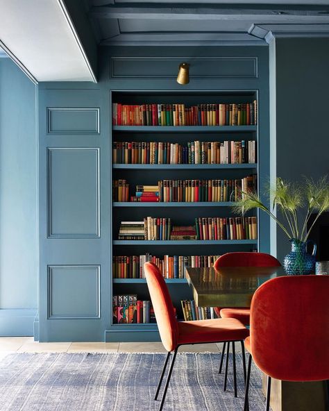 Blue Library Aesthetic, Integrated Bookshelves, Painted Built In Bookshelves, Modern Home Library, Blue Library, Blue Bookshelves, Dream Home Library, Nicola Harding, Orange Chairs