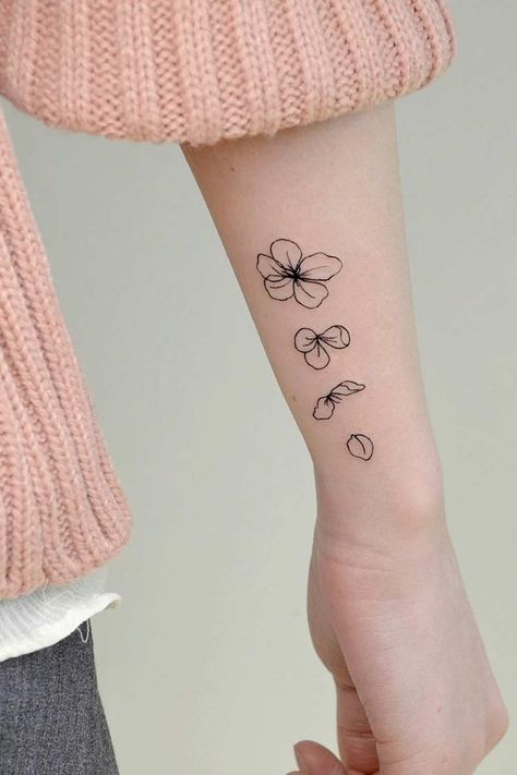 Cherry Blossom Tattoo Ideas And What To Know About It | Glaminati.com Blossoming Tattoo, Black Cherry Tattoo, Cherry Blossom Tattoo Ideas, Bloom Tattoo, Tattoo Over Scar, Sakura Tattoo, Cherry Tattoos, Flower Tattoo Drawings, Hand Poked Tattoo