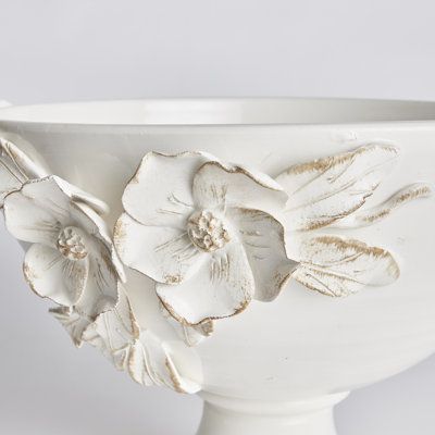 Each and every dogwood flower and leaf detail of the Fiori decorative bowl is handmade, and hand-applied by Italian artisans in Tuscany, Italy. A seamless design in a soft white glaze and delicate antiquing along petal edges. With classic Italian craftsmanship passed down through generations, each piece is a true original. On a grand scale, it is a dynamic centerpiece for a feature table, kitchen island, or mantel. Napa Home and Garden Fiori Decorative Footed Bowl - Decorative Plates & Bowls in Napa Home, Ceramics Pottery Bowls, Table Kitchen Island, Dogwood Flower, Air Dry Clay Projects, Pottery Handbuilding, Dogwood Flowers, Clay Crafts Air Dry, Flower Cup