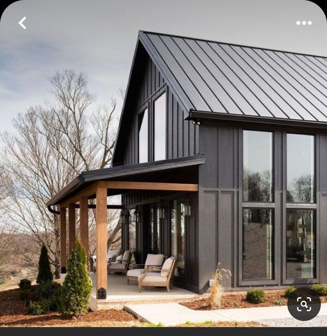 Black House With Cedar Accents, Dark Exterior Paint Colors, Black Farmhouse Exterior, Dark Exterior House Colors, Metal Siding House, Dark Exterior House, Black Houses, Barn Style House Plans, Exterior House Color