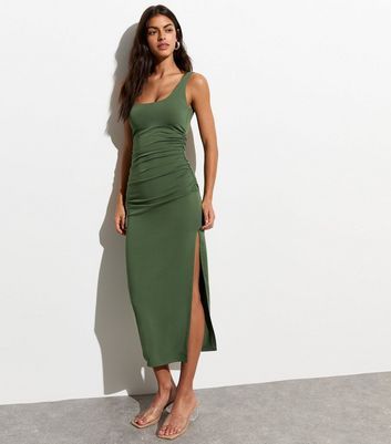 New Look Olive Square Neck Midi Dress. Designed in a flattering bodycon fit with a sleeveless summer-ready silhouette, this olive midi dress is here to solve your wardrobe dilemmas in style.- Olive- Bodycon fit- Stretch fabric- Midi length- Square neckline- Sleeveless- Ruched sides- Side split-Model is 5'9"/175cm and wears: UK 8/EU 36/US 4 Body Fitted Dress, Khaki Dresses, Square Neck Midi Dress, Olive Dress, Khaki Dress, 20's Dress, Summer Ready, Petite Maternity, Smock Dress