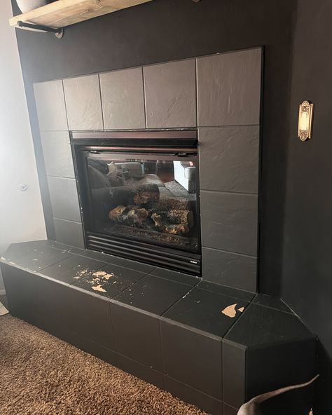 One more thing done for our living room update! This fireplace tile was originally just the white builder grade tile that had been on the floor. When we moved in I just painted over the tiles, that worked great for a few years, but it wasn’t perfect and required some kind of yearly touch up. With the dark wall I wanted to add in a lighter color and some texture to the home. Next on the list in an old wood mantel and then floors! Wood Mantel, Builder Grade, Wood Mantels, Living Room Update, Room Update, Dark Wall, Fireplace Tile, Old Wood, Touch Up